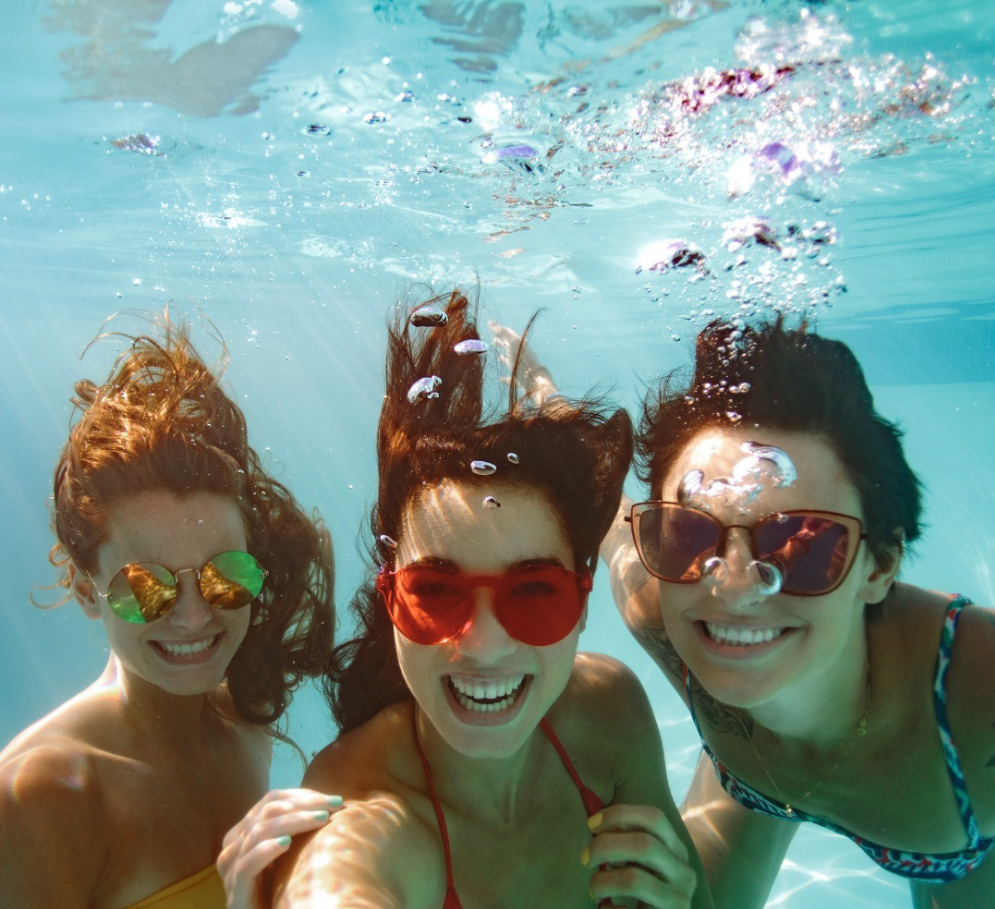 Three girls underwater having fun